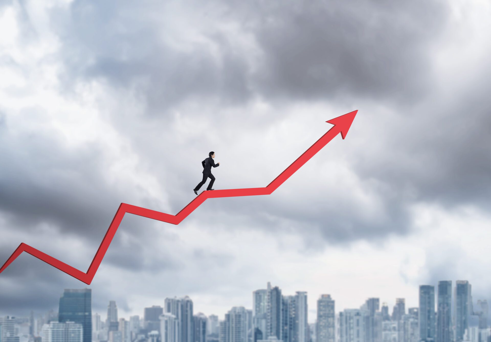 Young businessman running on chart arrow going up Young businessman running on chart arrow going up